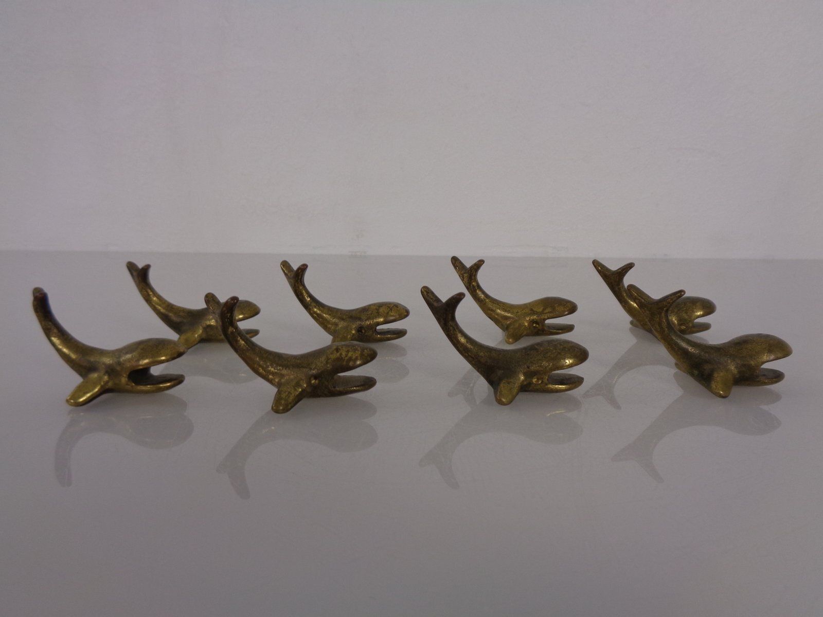 Whale Shaped Brass Paperweights Or Knife Rests In The Style Of Walter Bosse, Austria, 1950s, Set Of 4 photo for sale