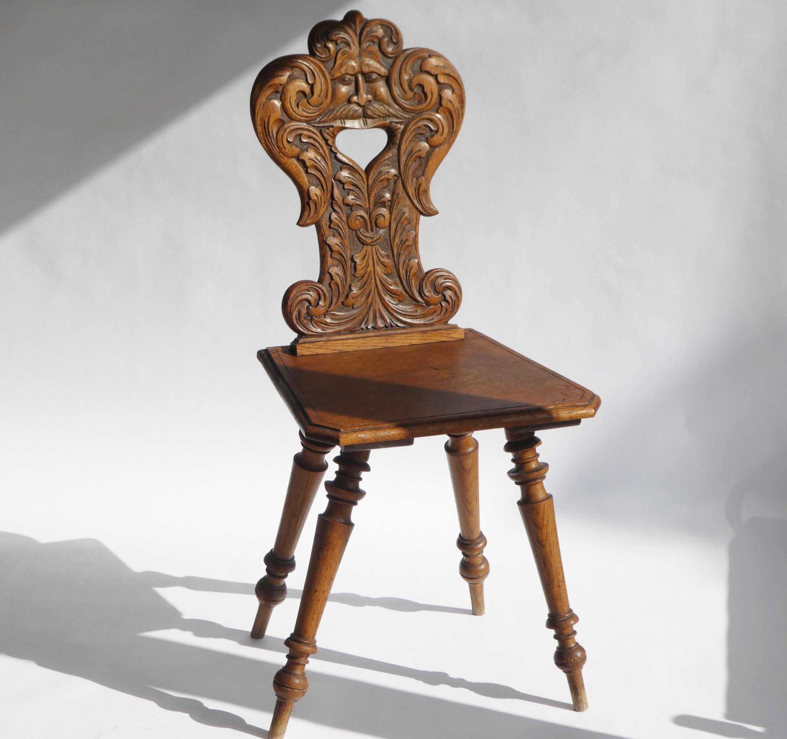 Antique Alpine Oak Folk Art Chair With Carved Face Mask, Brutalist Escabelle Wooden Chair photo furniture