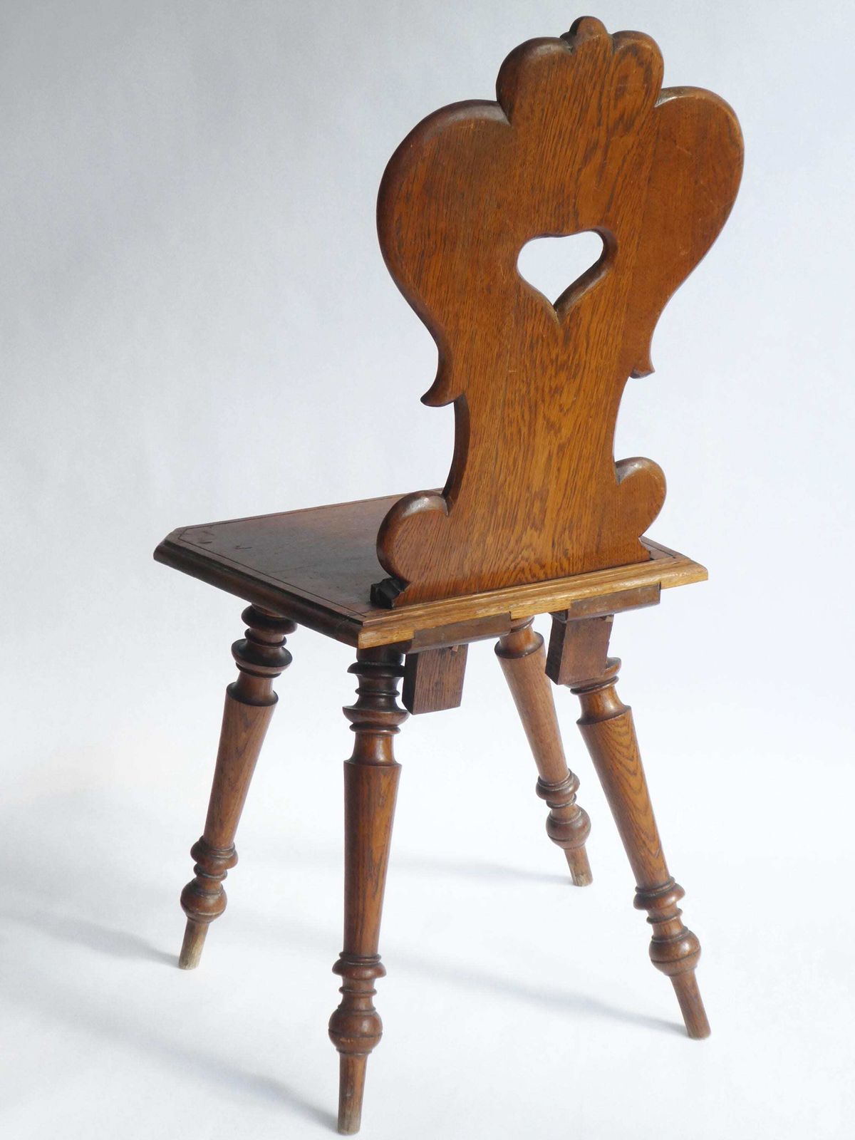Antique Alpine Oak Folk Art Chair With Carved Face Mask, Brutalist Escabelle Wooden Chair photo vintage