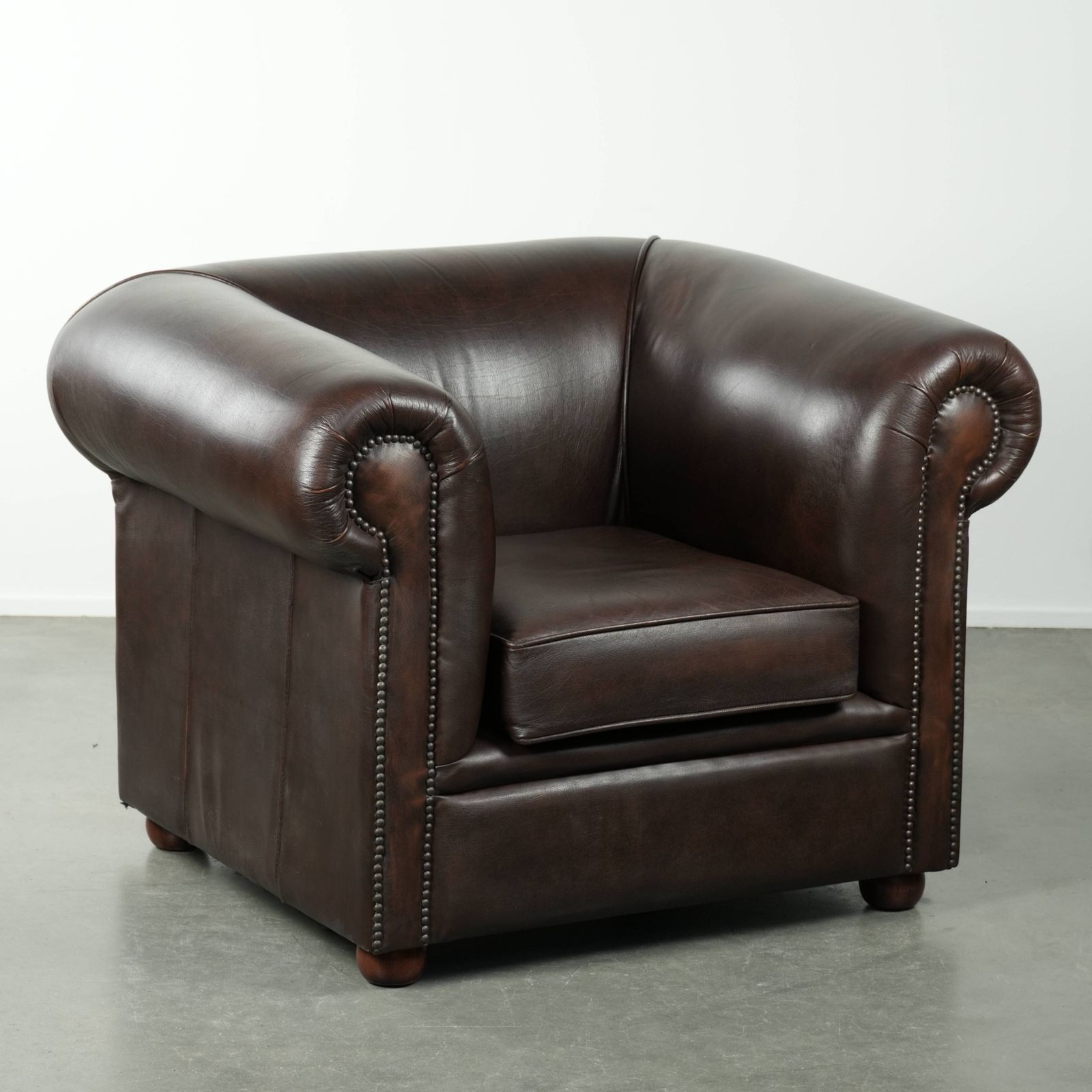 Luxurious Brown Cowhide Chesterfield Armchair With A Timeless English Look.