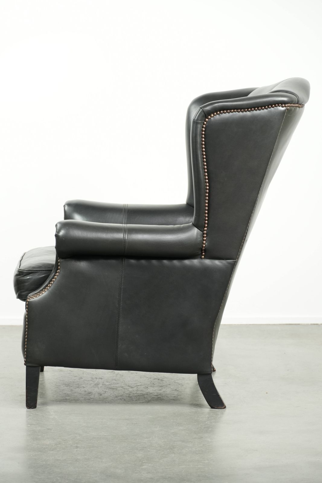 Black Cowhide Wing Armchair In A Classic English Style, Finished With Decorative Nails. photo 896.0