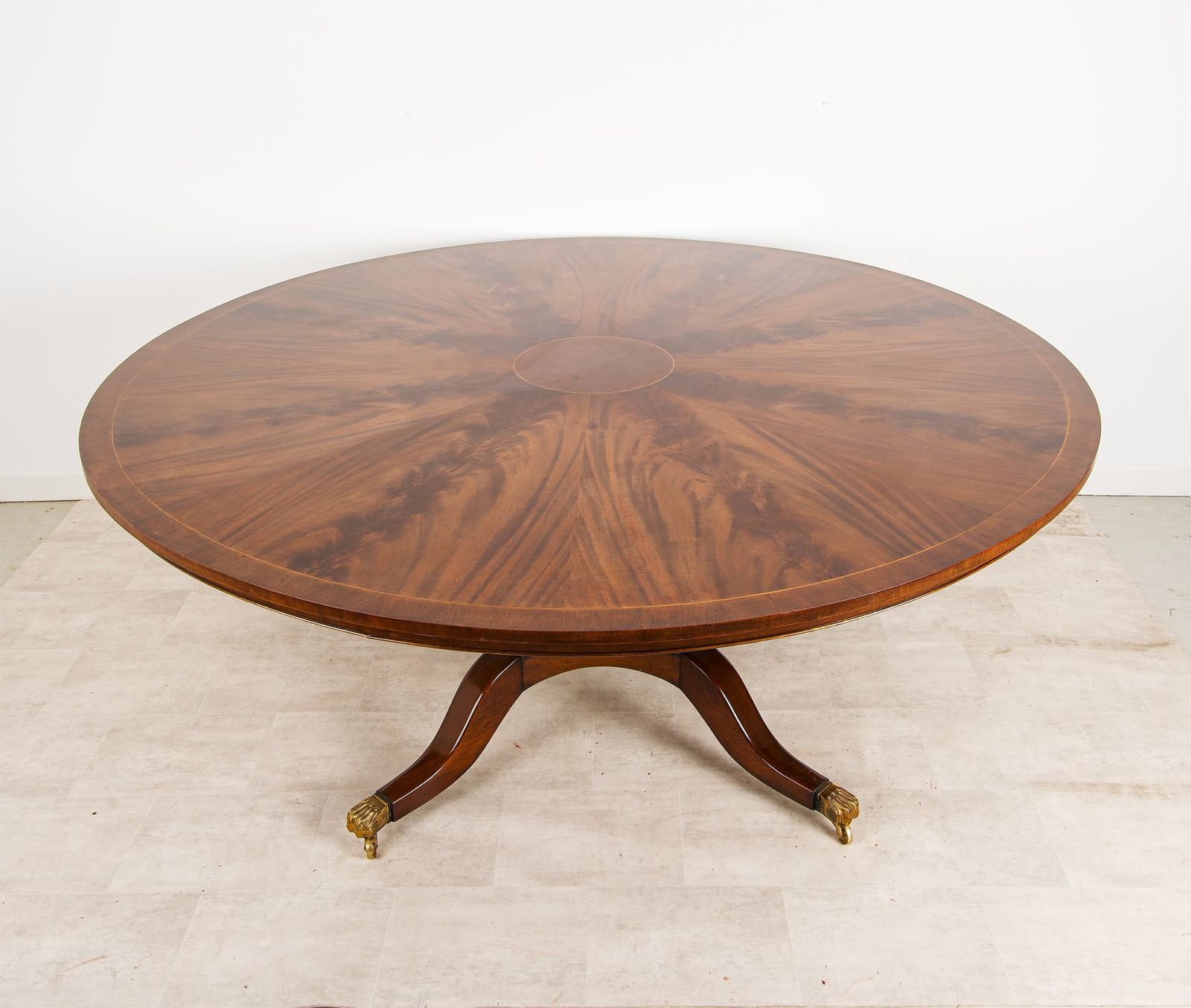 Large Regency Style Flame Mahogany Circular Dining Table With Brass Lion Paw Castors