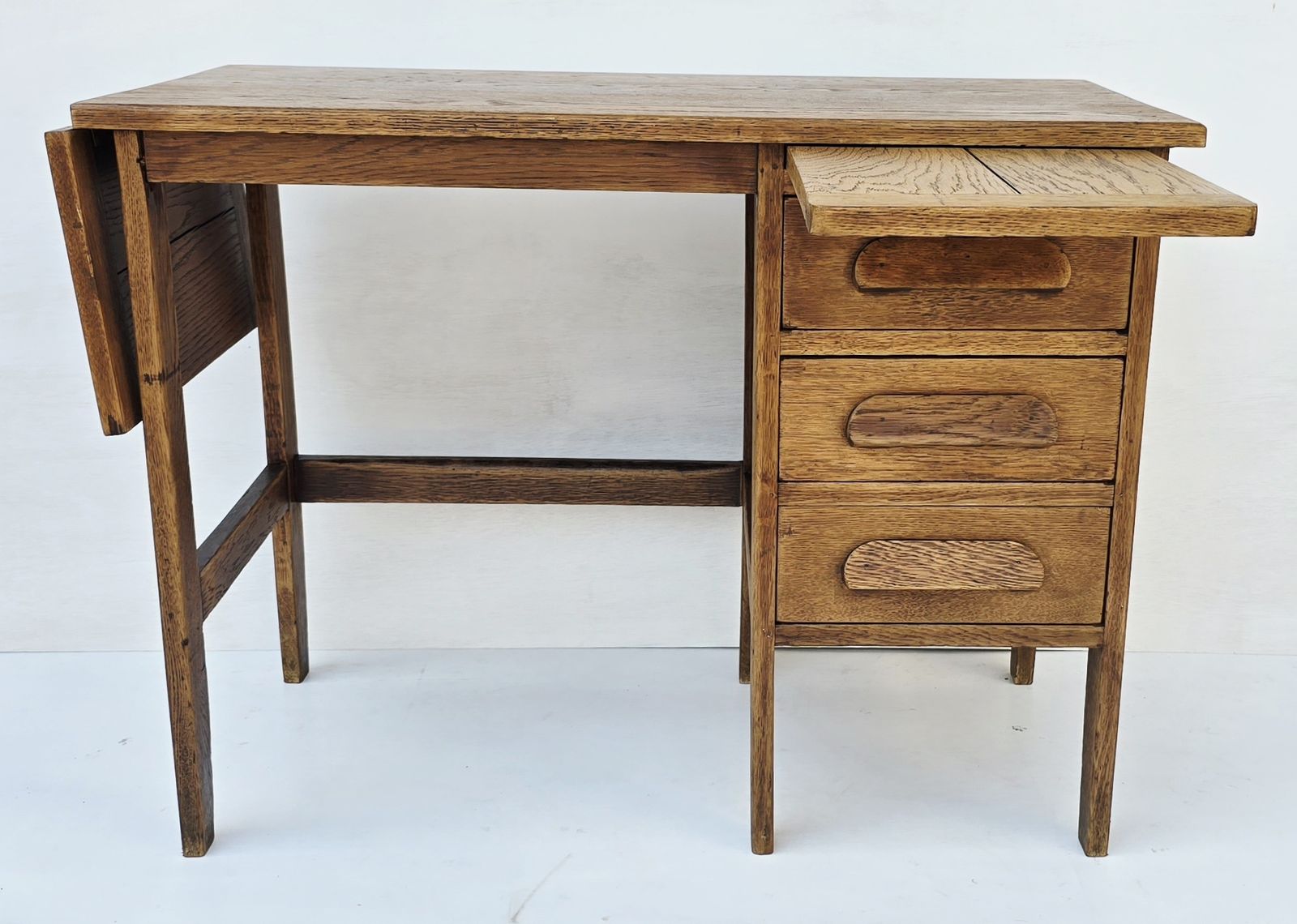A Petite Mid Century Oak Drop Leaf Desk, Single Pedestal. photo vinterior