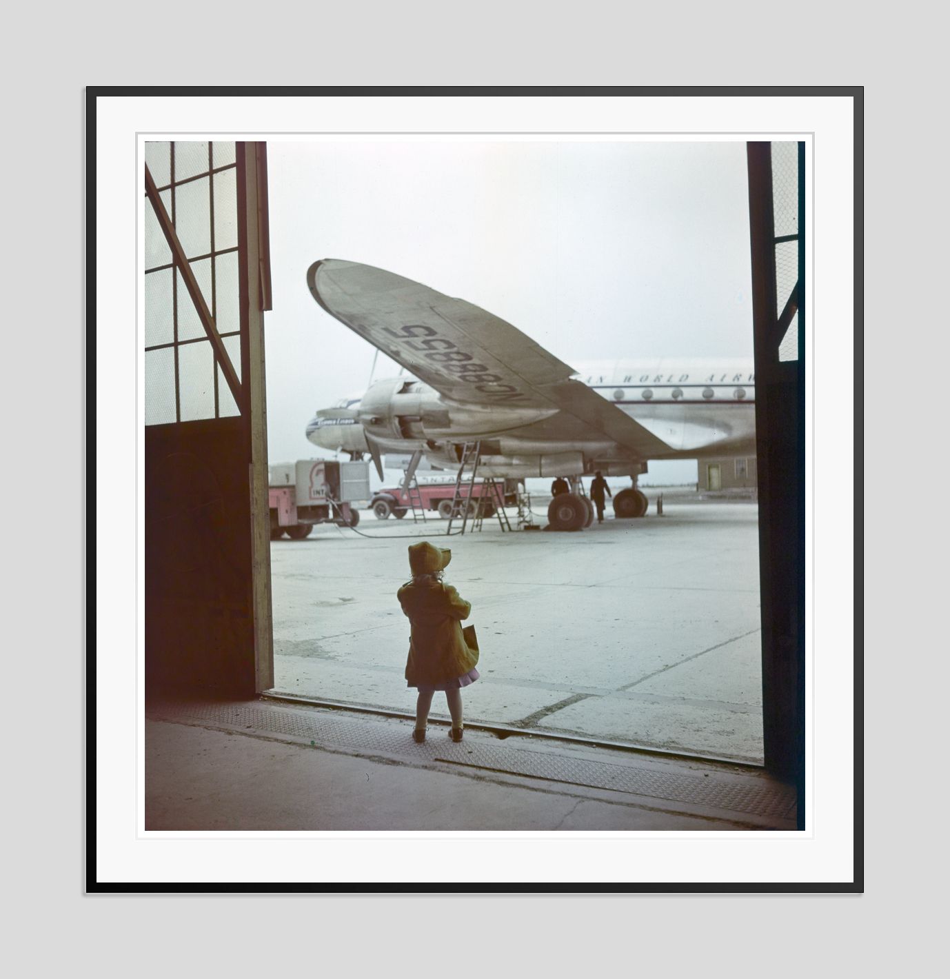 Toni Frissell 'Young Traveller' Archival Pigment Print Framed In Black photo furniture