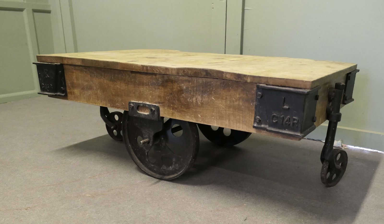 A Unique Wood Framed Industrial Coffee Table The Table Has A Thick Wooden Top