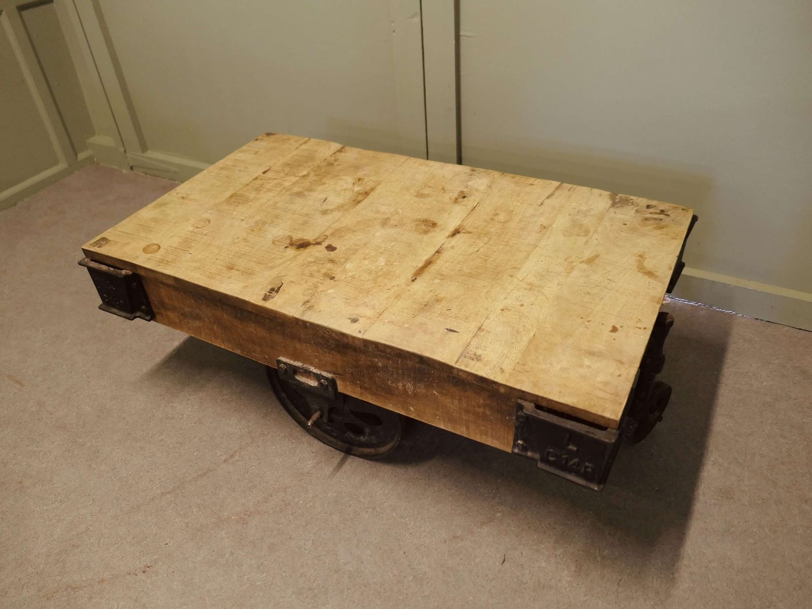 A Unique Wood Framed Industrial Coffee Table The Table Has A Thick Wooden Top photo furniture