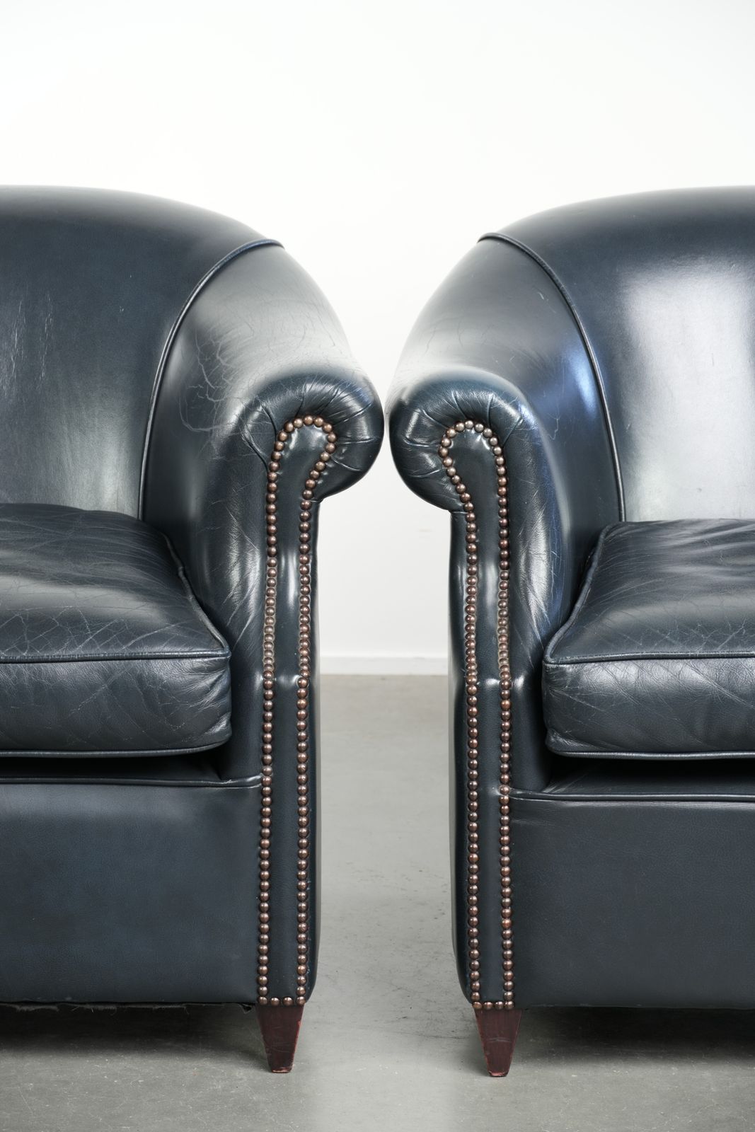 photo for sale Beautiful And Comfortable Set Of Dark Blue Cowhide Club Armchairs With A Unique And Timeless Design