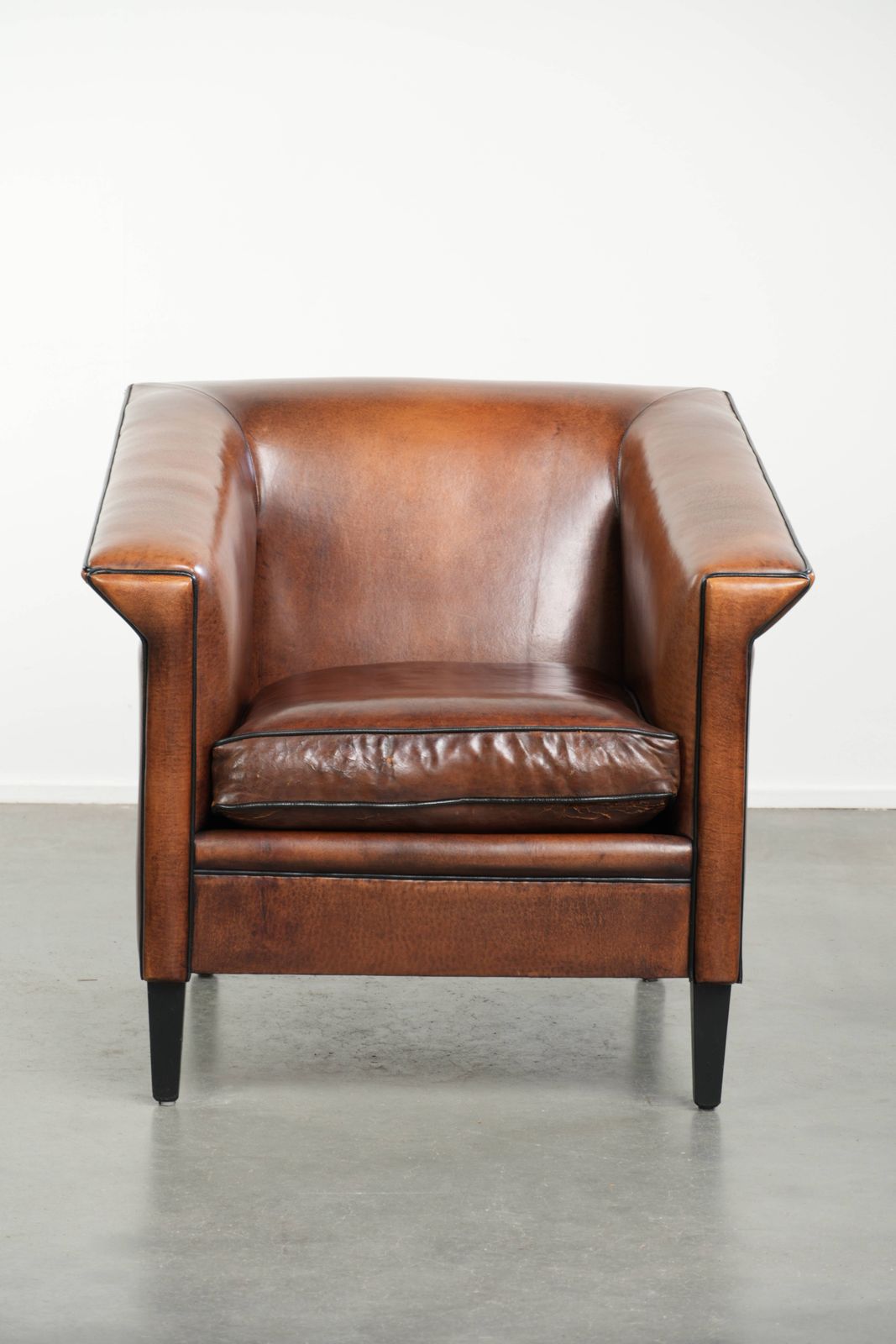 Beautiful, Sleek Art Deco Design Armchair/Lounge Chair In Sheepskin With Black Piping And A Gorgeous Warm Color. photo furniture