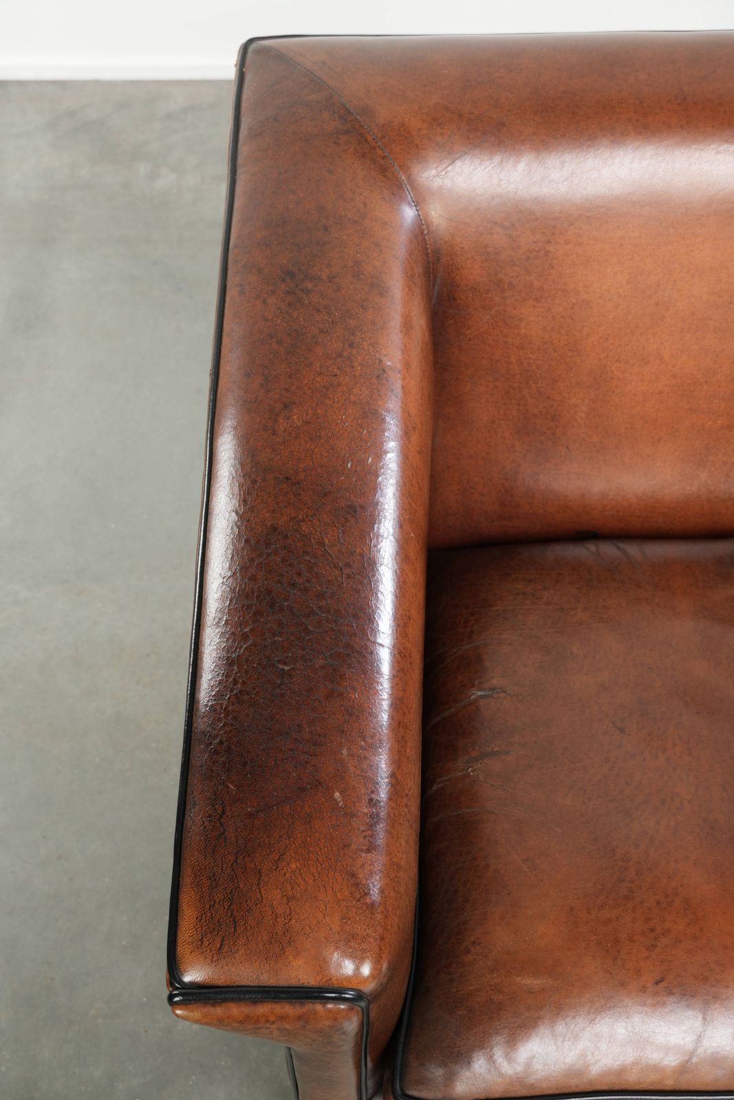 Sleek Sheepskin Art Deco Design Armchair With Black Piping And A Beautiful Warm Color photo buy