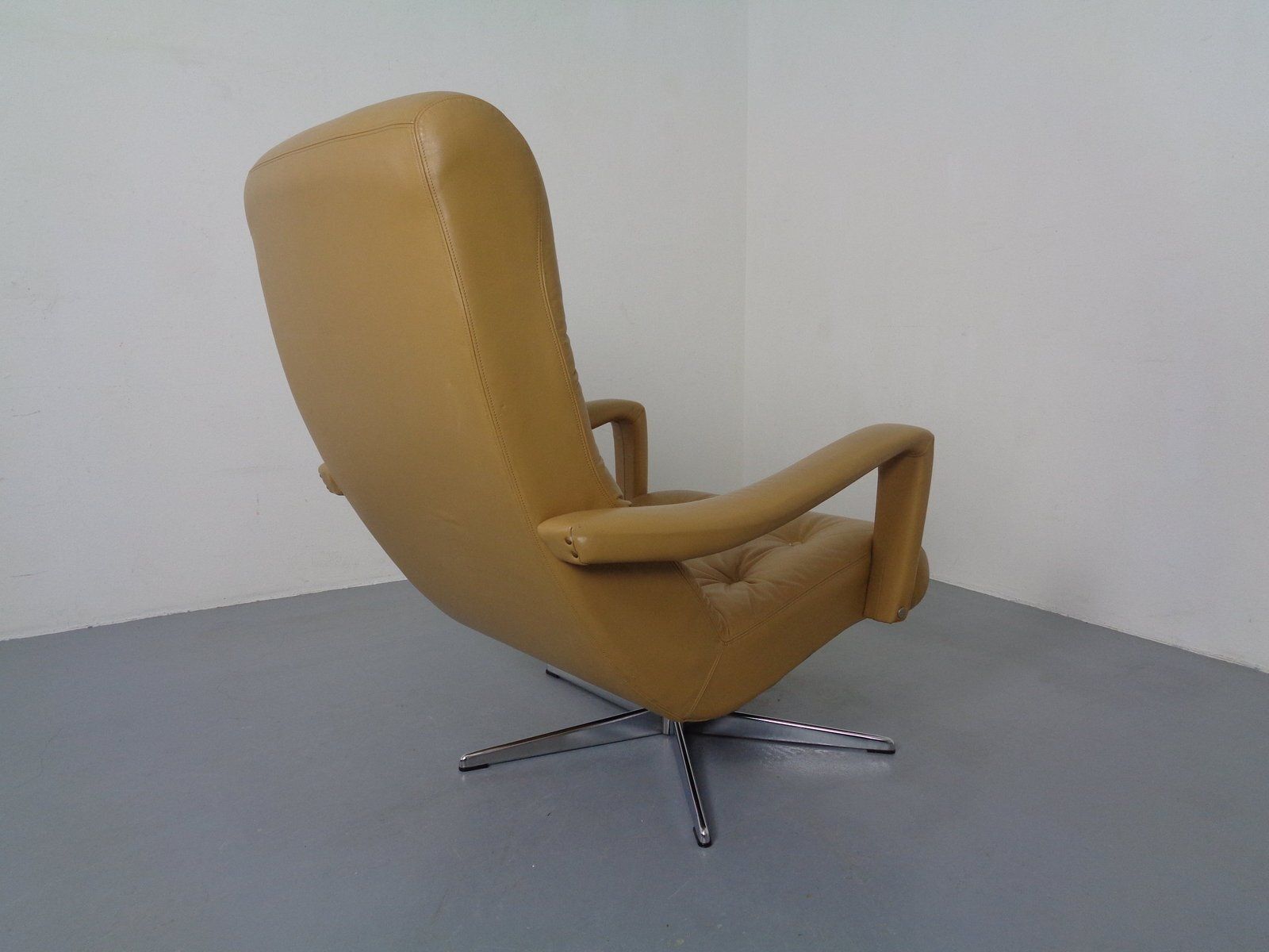 photo buy Set Of Leather Swivel Easy Chair And Ottoman, Switzerland, 1960s