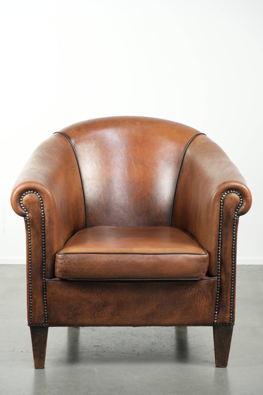 Characterful And Comfortable Sheepskin Club Armchair With A Beautiful Patina And A Refined Finish With Black Piping. photo furniture