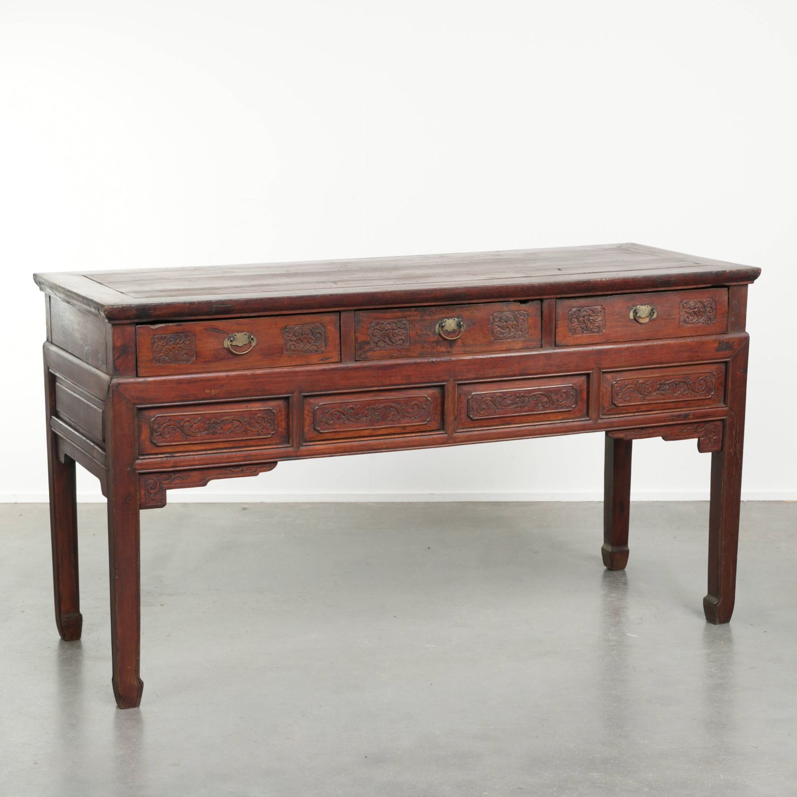 Antique Wooden Chinese Sideboard From The Late 19th Century In A Beautiful Red Color With Exquisite Wood Carving.