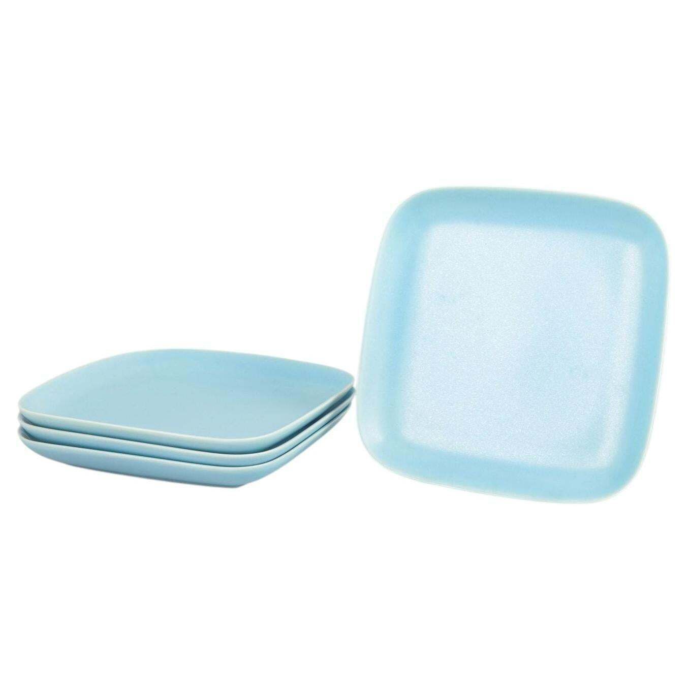 Höganäs Keramik, quatre assiettes plates carrées en glaçure turquoise, fin du XXe siècle
