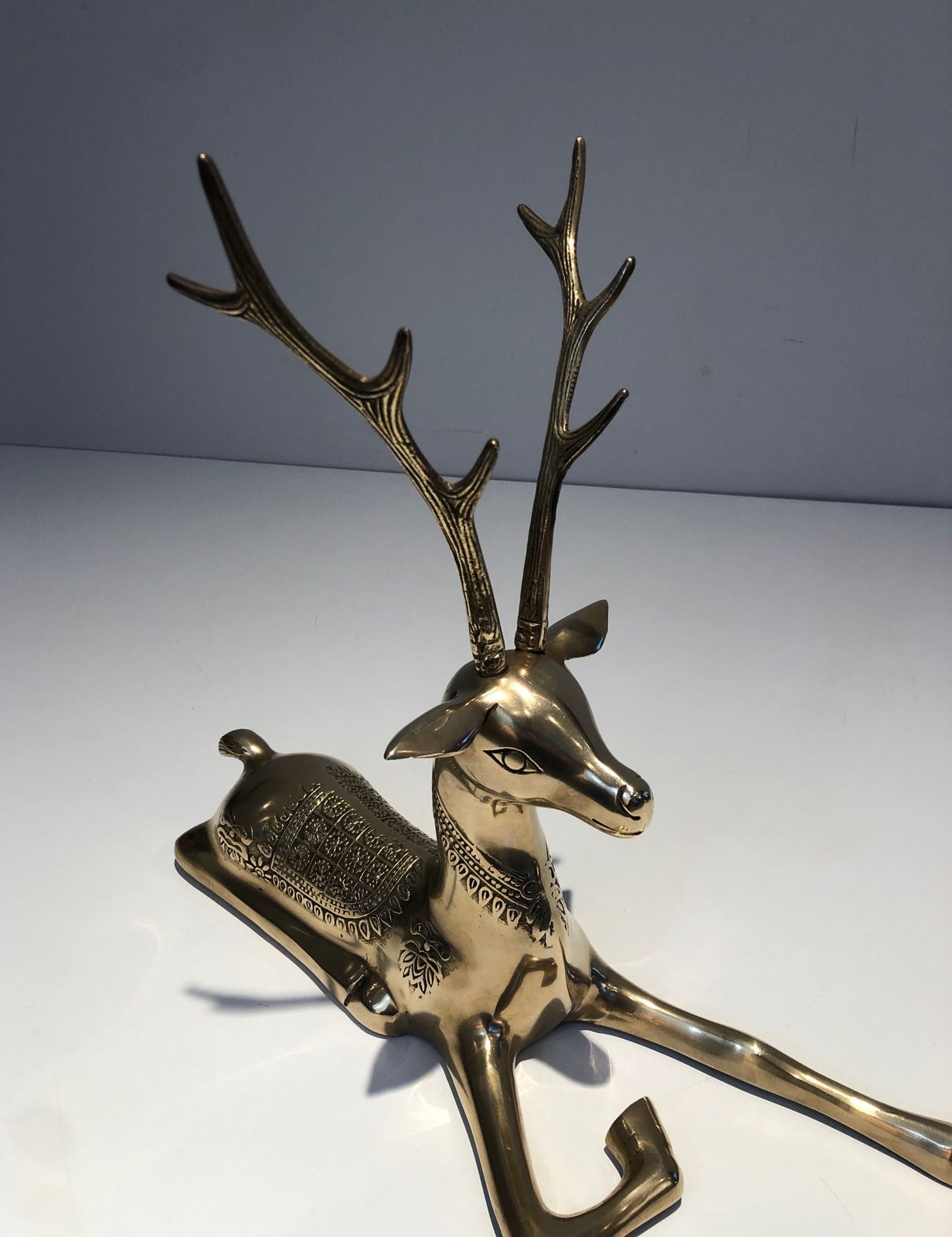 Pair Of Bronze Reclining Deer Engraved With Shamanic Motifs. French Work. Circa 1970 photo buy