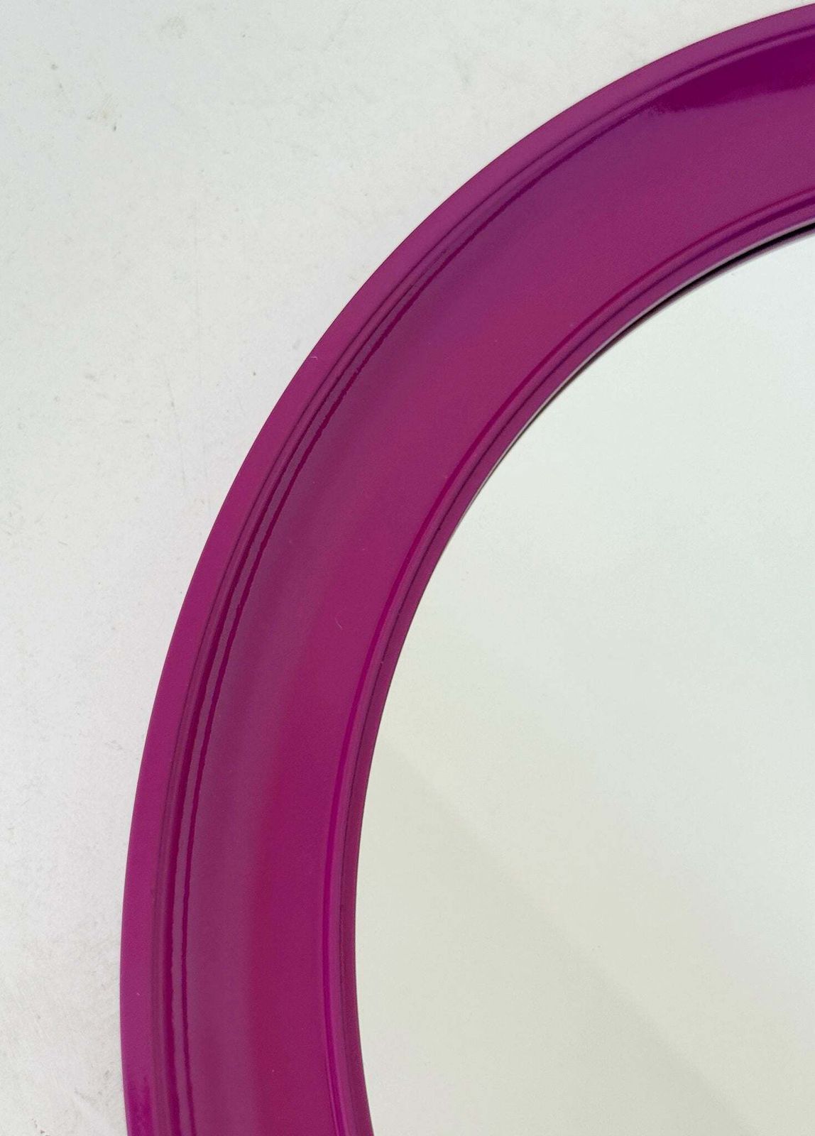 Round Mirror With Purple Plastic Frame photo furniture