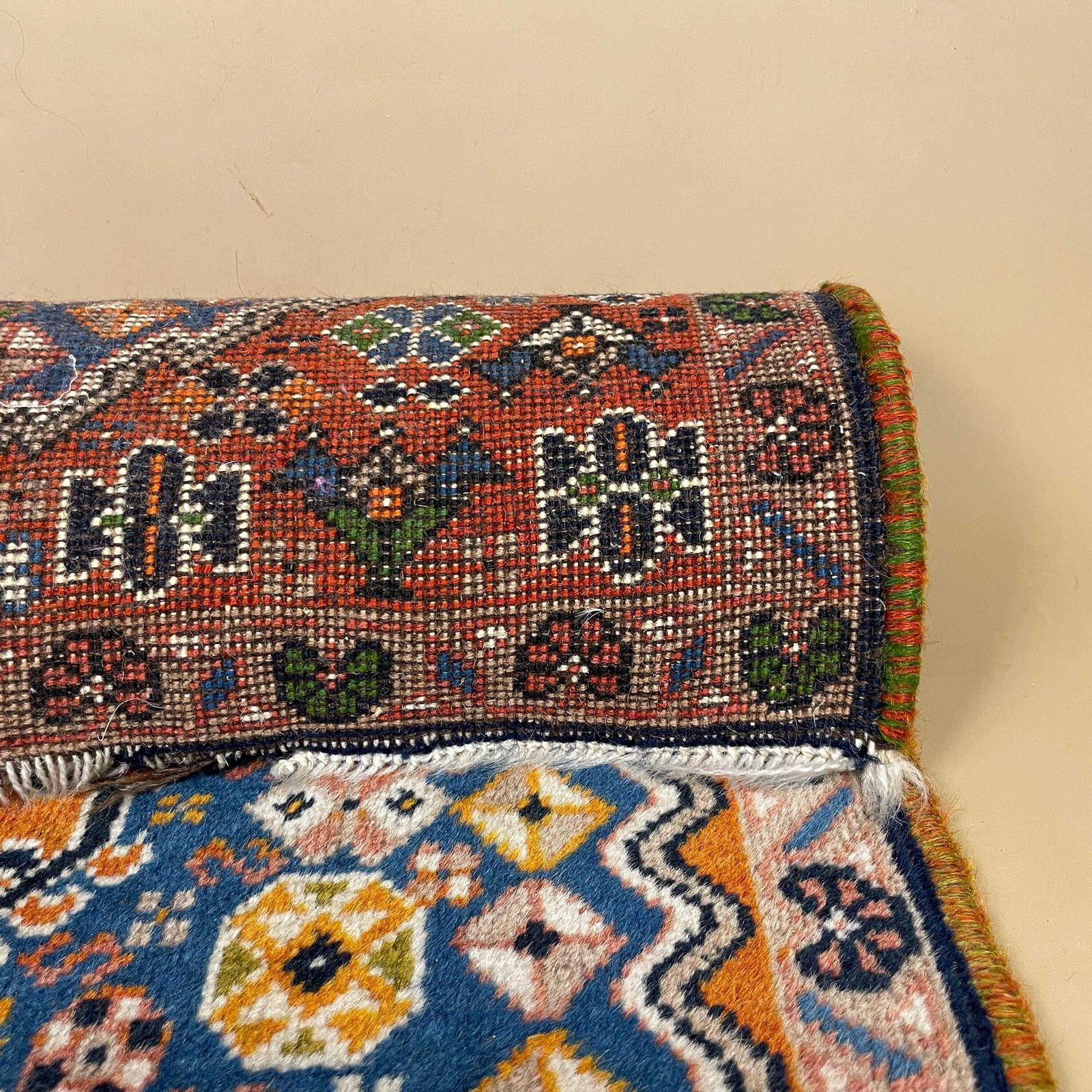 Textiles Small Accent Rug Wool Middle Eastern Style Decorative Tasselled Orange Blue Detailed Pattern photo