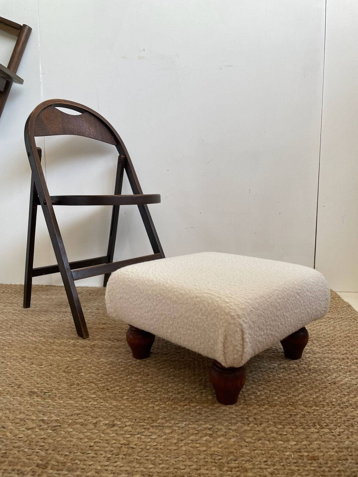 Chunky Low Lying Footstool With Tapered Legs And Cream Boucle Fabric
