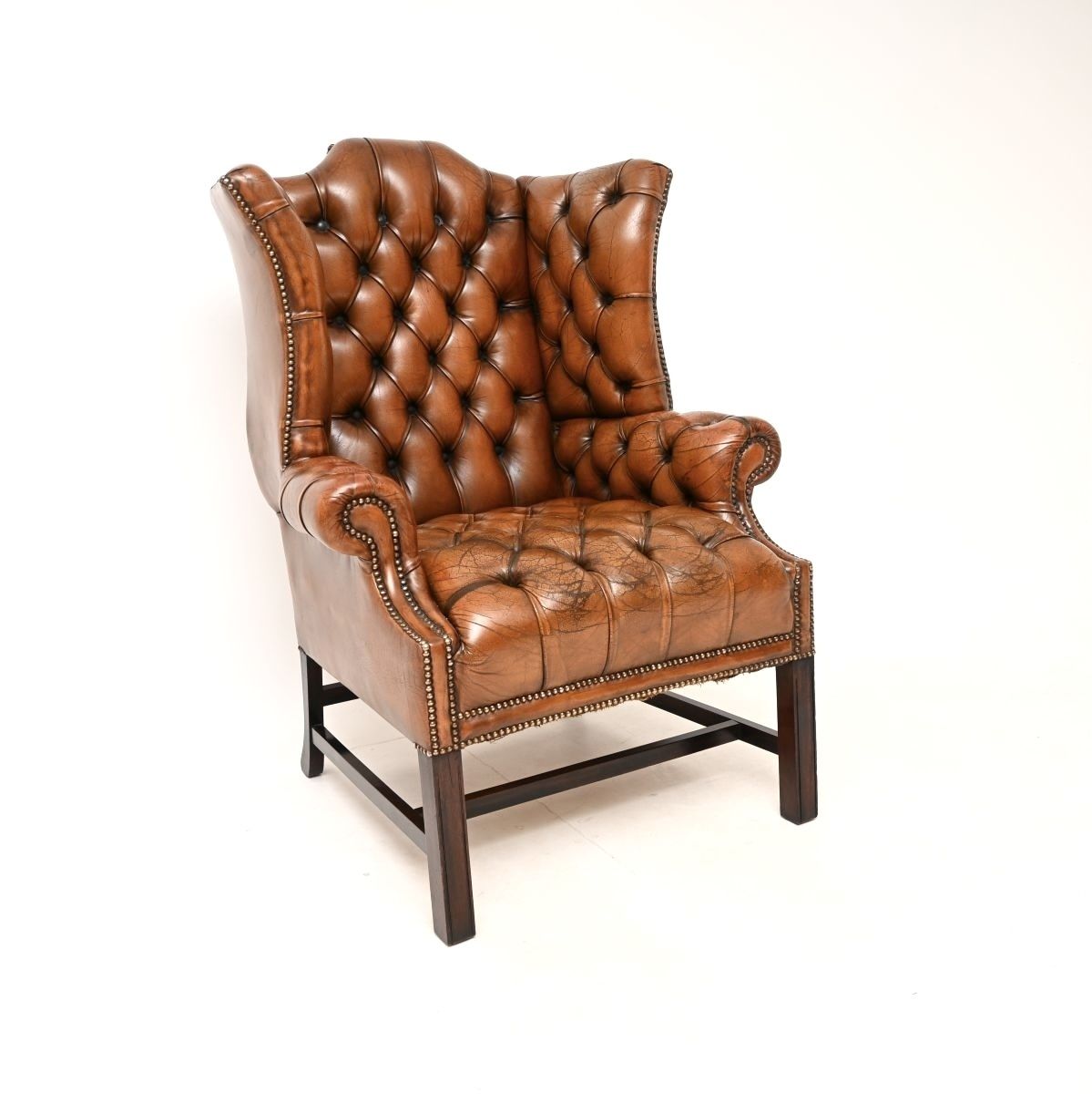 photo furniture Antique Deep Buttoned Leather Wing Back Armchair