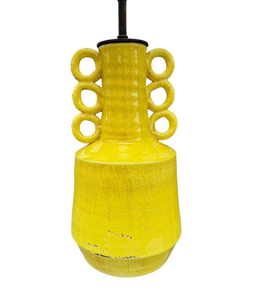 A Mid Century Style Yellow Ceramic And Bronze Lamp With Six Handle Design. photo Lighting