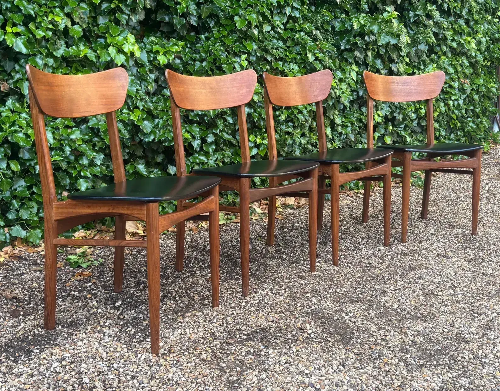 Set Of Four Mid Century Teak Vinyl Dining Chairs photo for sale