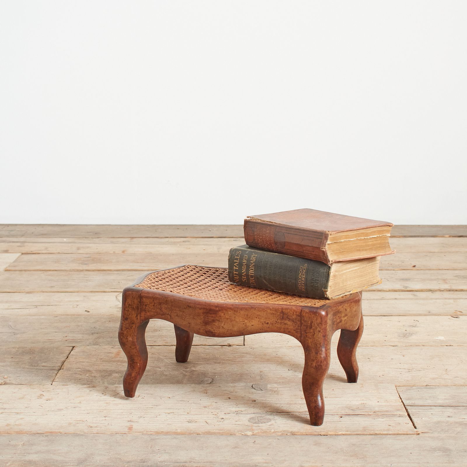 Small Antique French Cane Foot Stool.