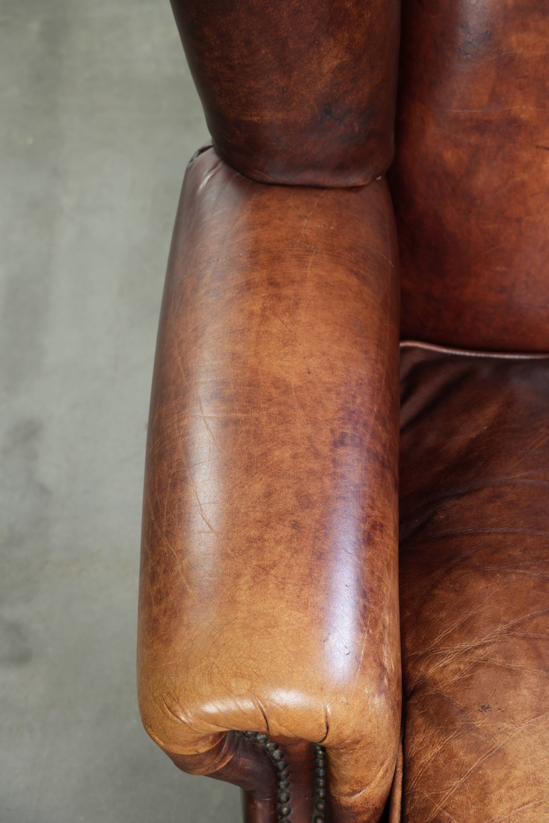 Comfortable English Style Cowhide Wing Armchair With A Beautiful Warm Color Scheme And A Characterful Appearance. photo buy