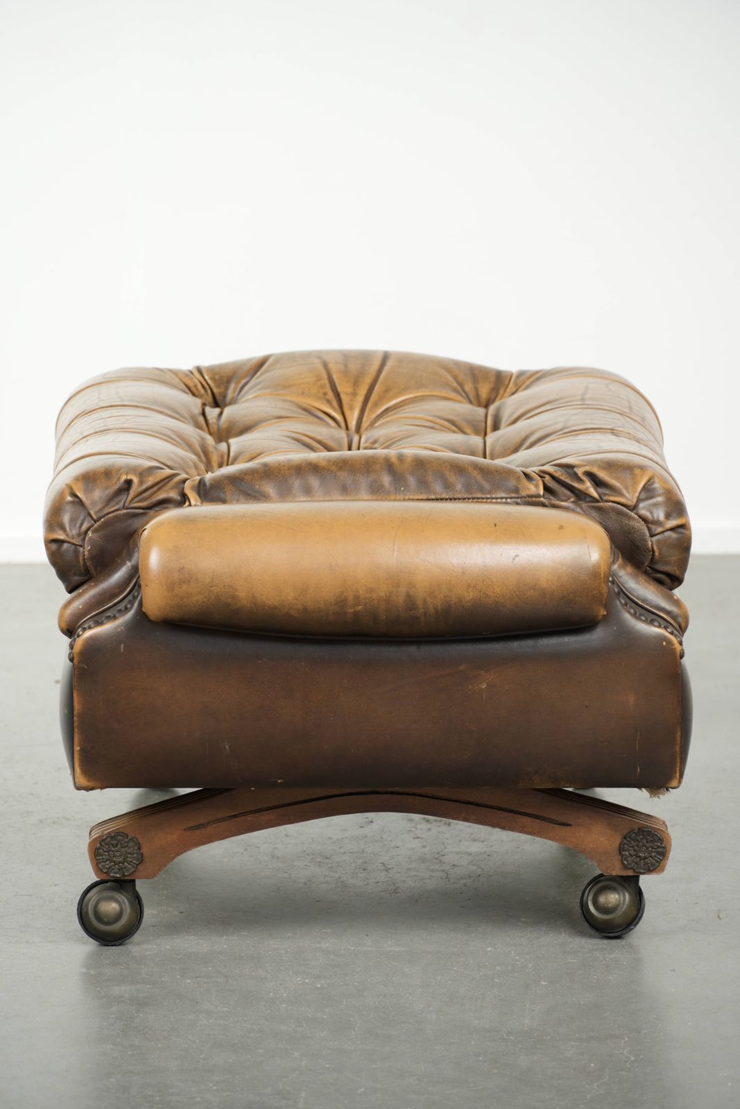 Unique And Elegant English Chesterfield Ottoman In Cowhide Leather On Wheels And Finished With Decorative Nails. photo 514.0