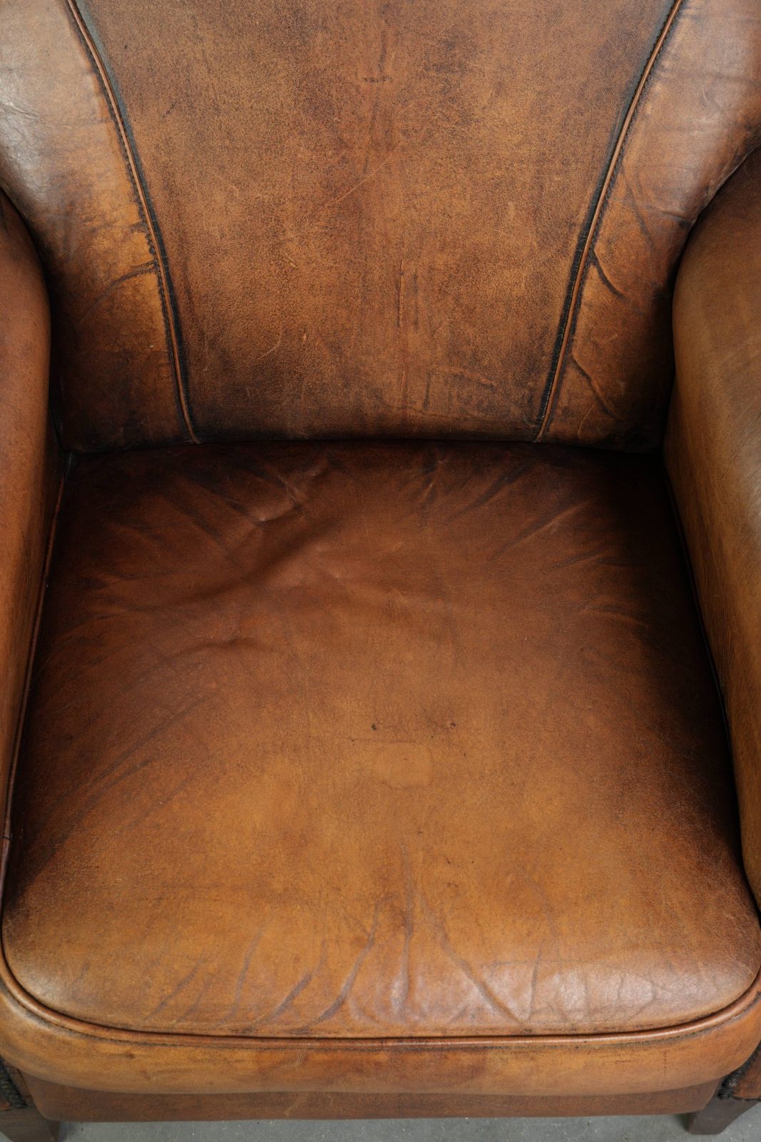 Comfortable, Characterful Sheepskin Armchair Finished With Decorative Nails And A Beautiful Patina photo vinterior