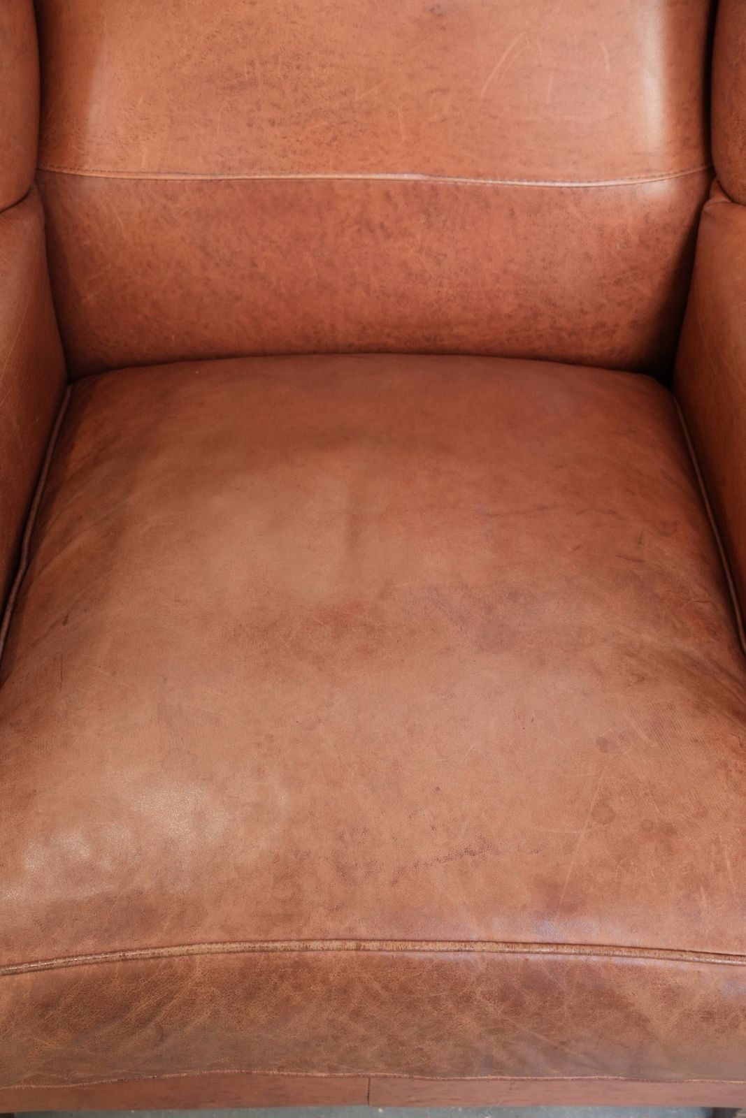 Set Of Two Beautiful English Style Cowhide Wing Armchairs With Matching Piping And A Characterful Appearance photo for sale