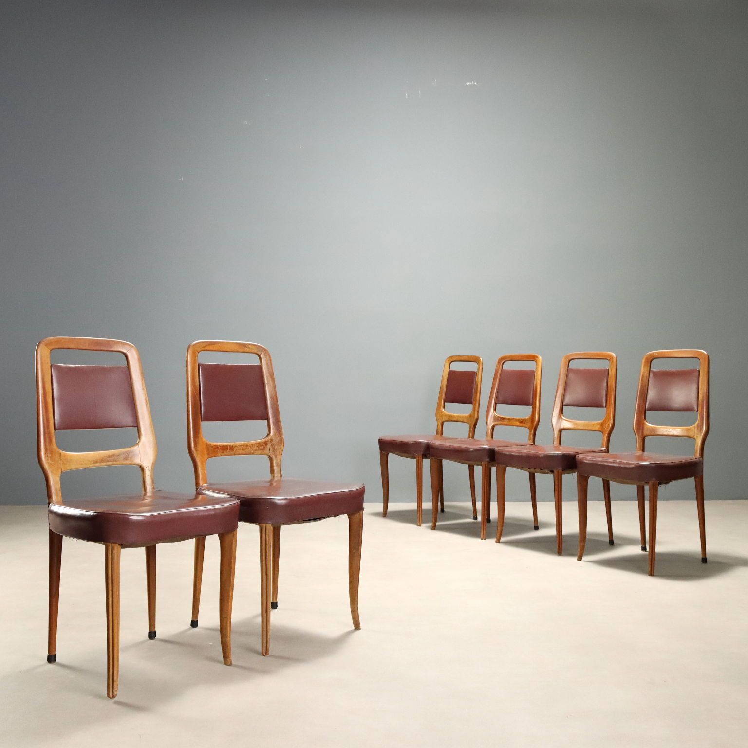 Vintage stoelen beukenhout kunstleer bekleding design jaren 1950