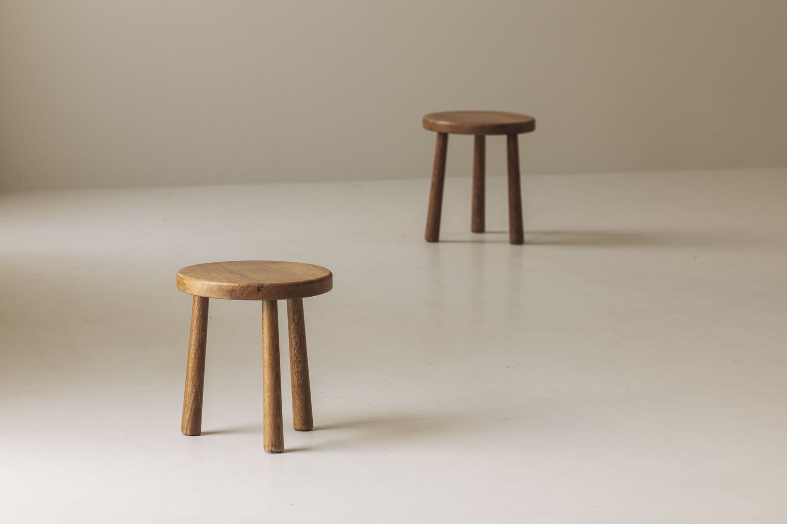 A Sculptural Set Of Two Solid Oak Stools, Produced In France During The 1960s.