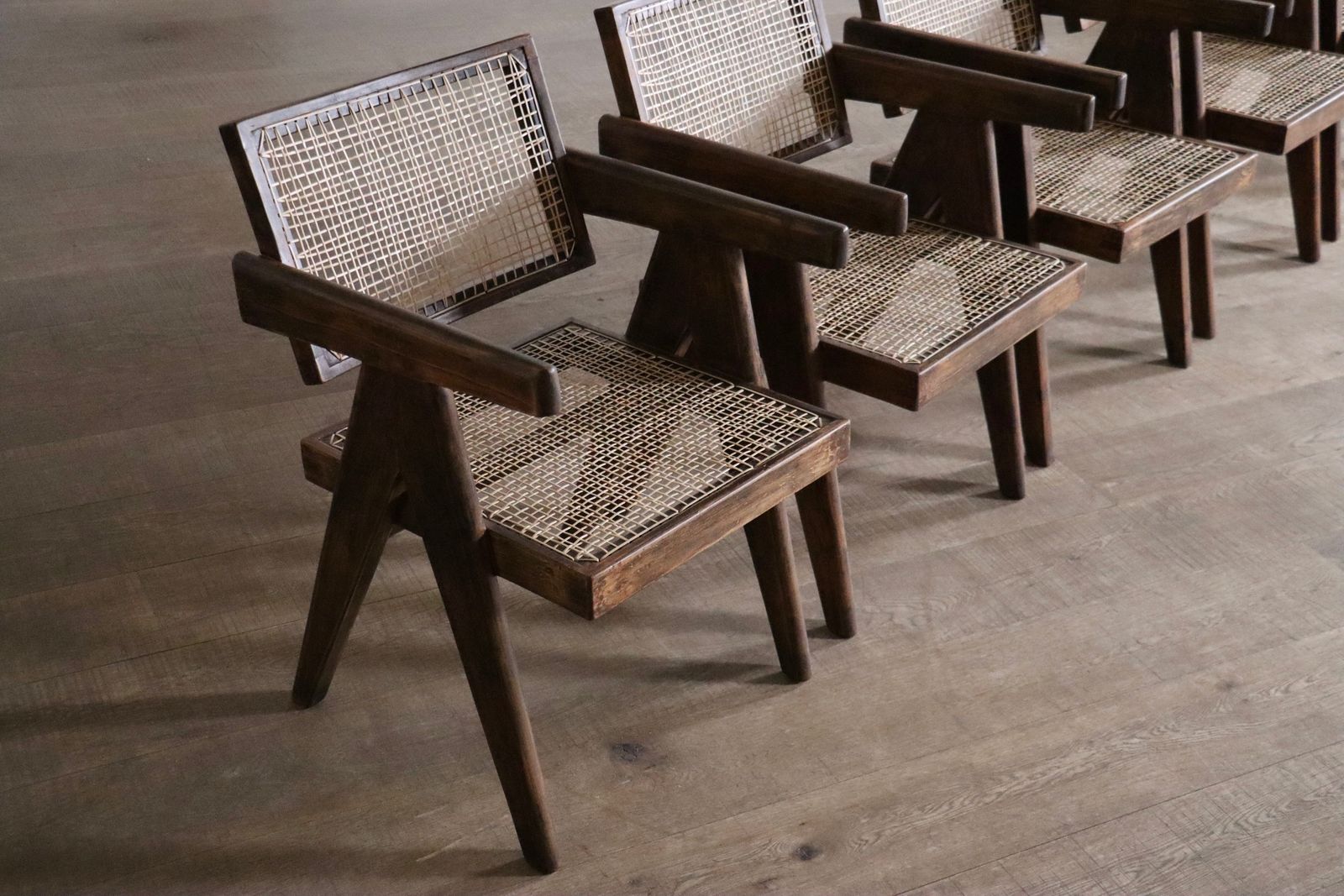 photo furniture Set van 8 Pierre Jeanneret Office Cane Chairs, India ca. jaren 1950