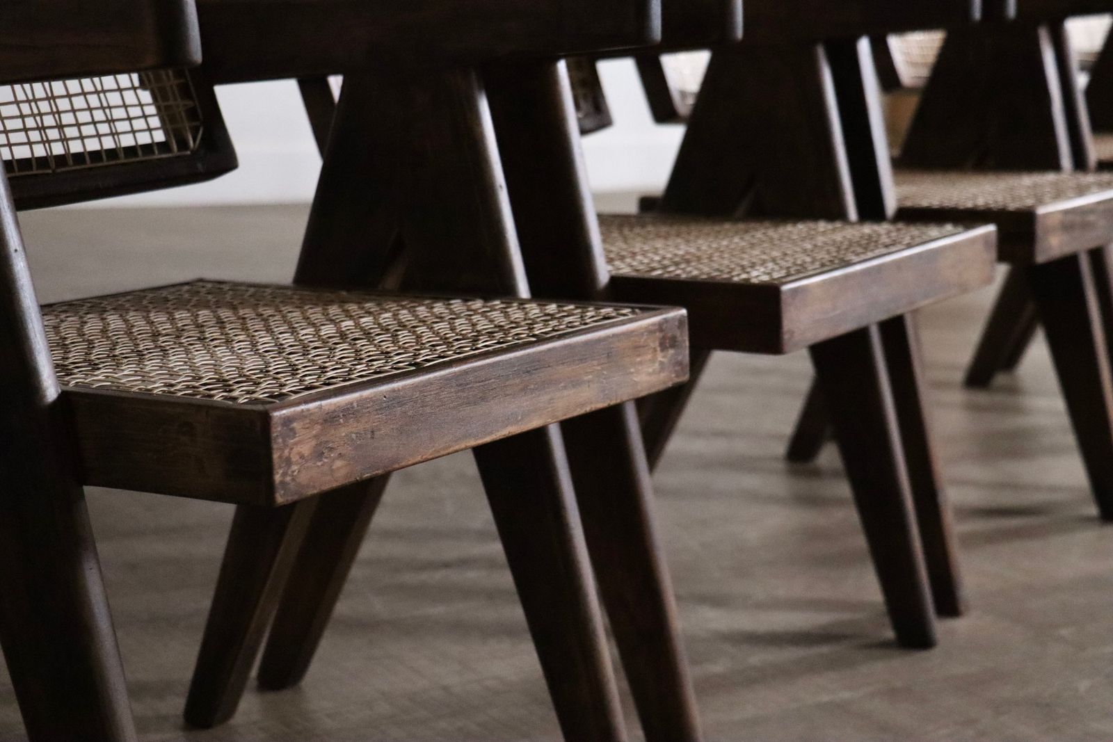 photo for sale Set van 8 Pierre Jeanneret Office Cane Chairs, India ca. jaren 1950