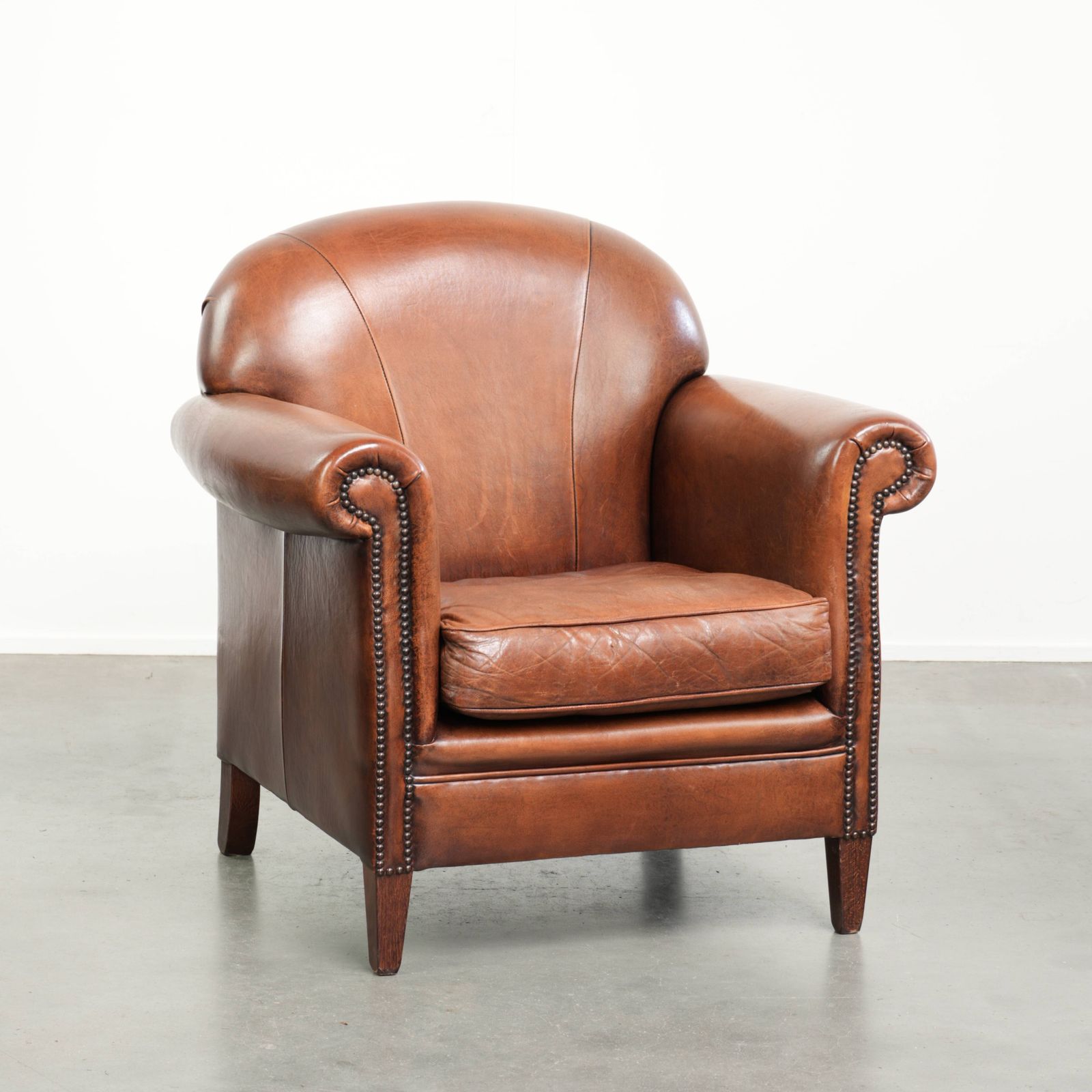 Vintage Sheep Leather Armchair With A Comfortable Seat And Finished With Ornamental Nails