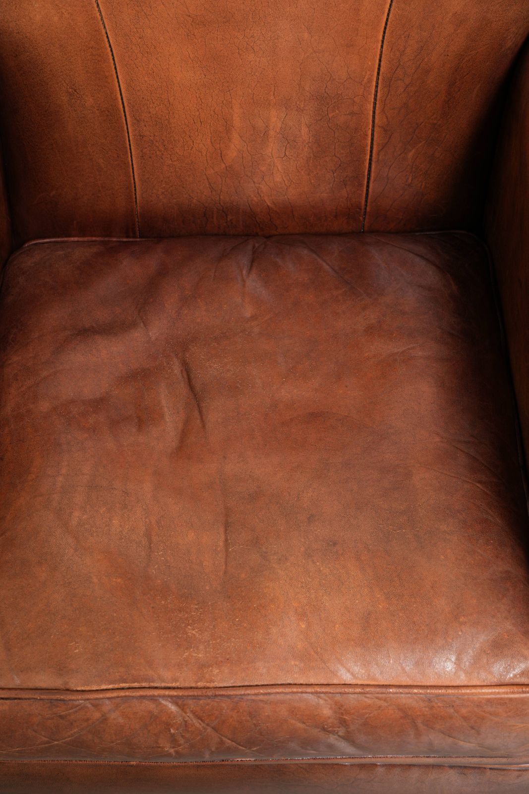 Vintage Sheep Leather Armchair With A Comfortable Seat And Finished With Ornamental Nails photo vinterior