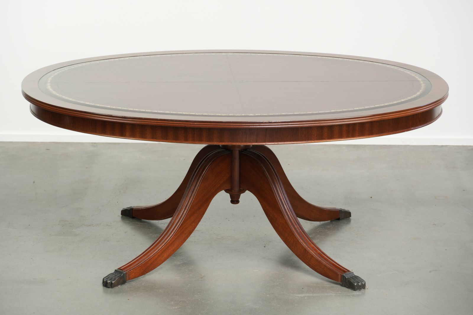 Elegant Oval Coffee Table With A Red Leather Top In English Style With Beautiful Details From The 20th Century photo Furniture