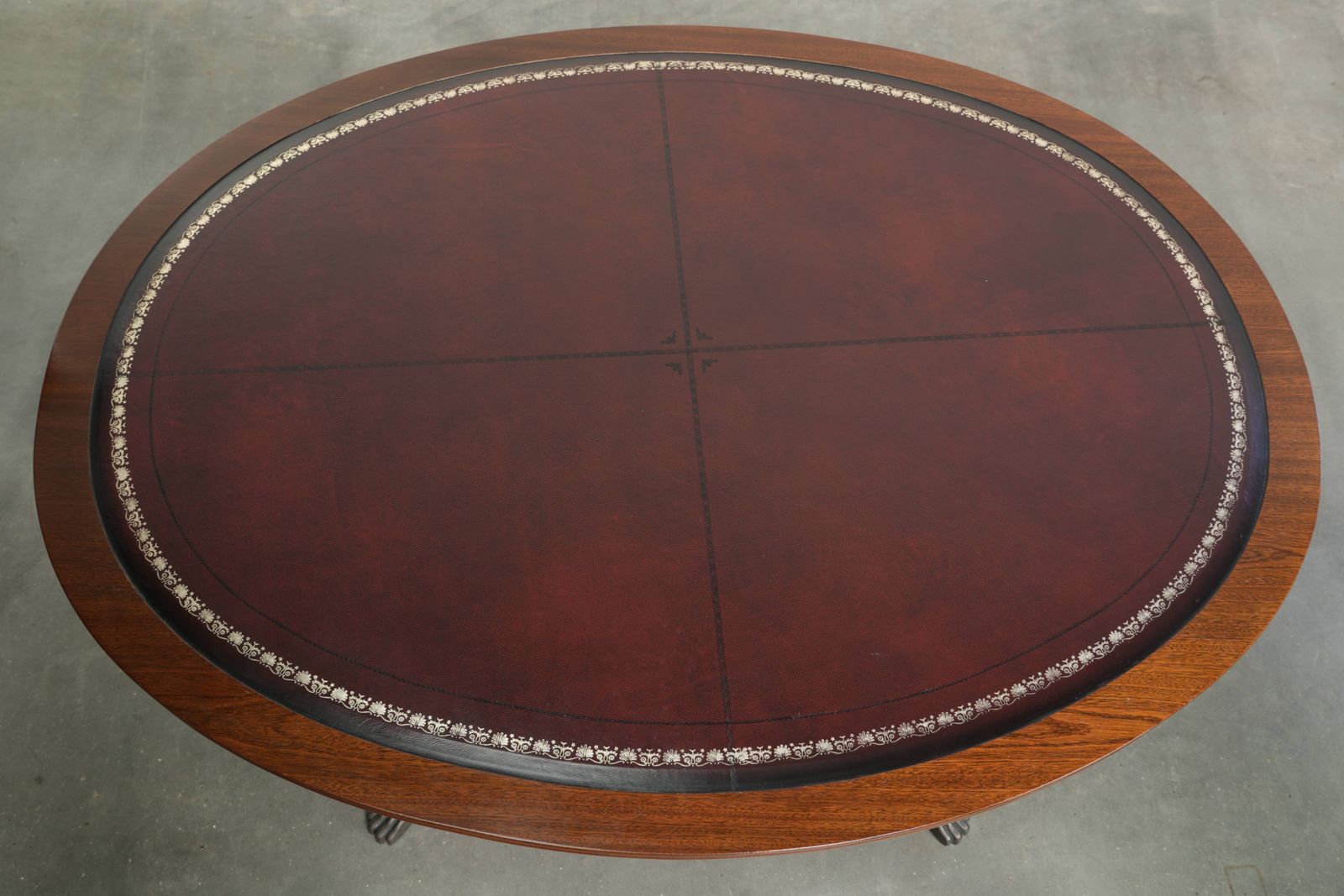 Elegant Oval Coffee Table With A Red Leather Top In English Style With Beautiful Details From The 20th Century photo vinterior