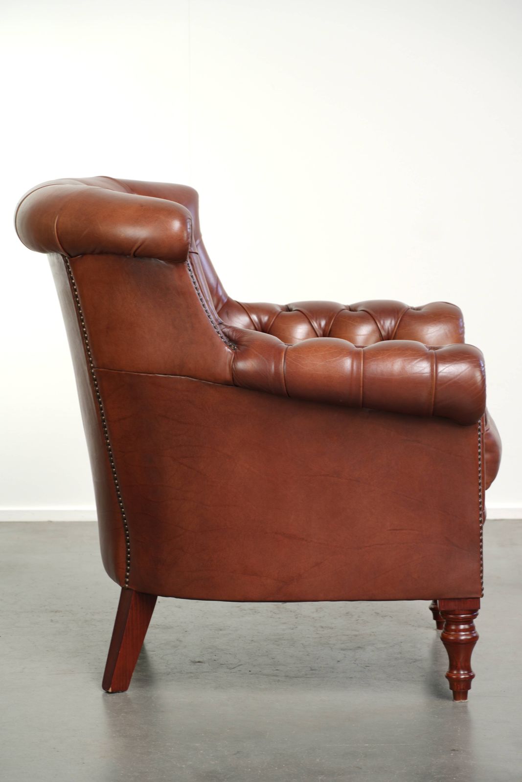 Very High Quality Cognac Colored Cowhide Chesterfield Armchair In English Style With A Timeless Design photo for sale