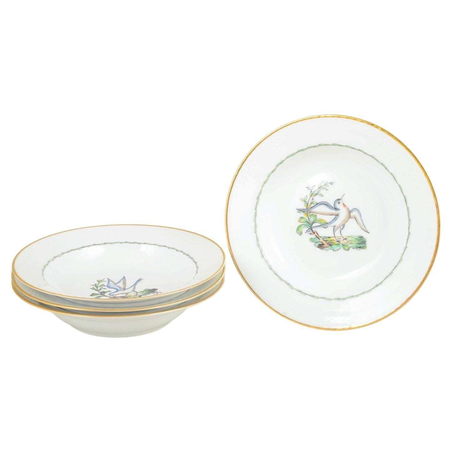 Royal Copenhagen. Set Of Four Large Deep Plates With Bird Motifs. Early 20th C.