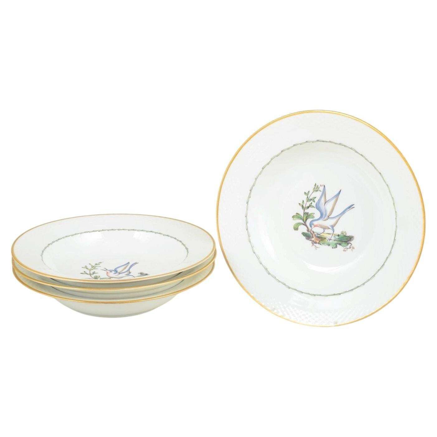 Royal Copenhagen. Set Of Four Large Deep Plates With Bird Motifs. Early 20th C.