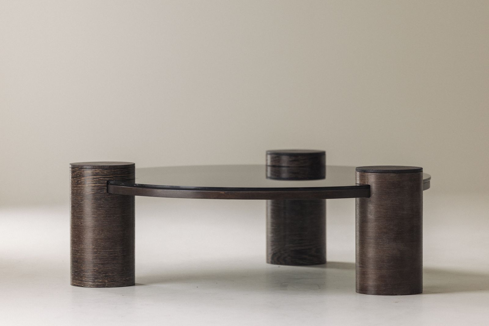 photo buy Sculptural Brutalist Wengé And Smoked Glass Round Coffee Table, 1970s