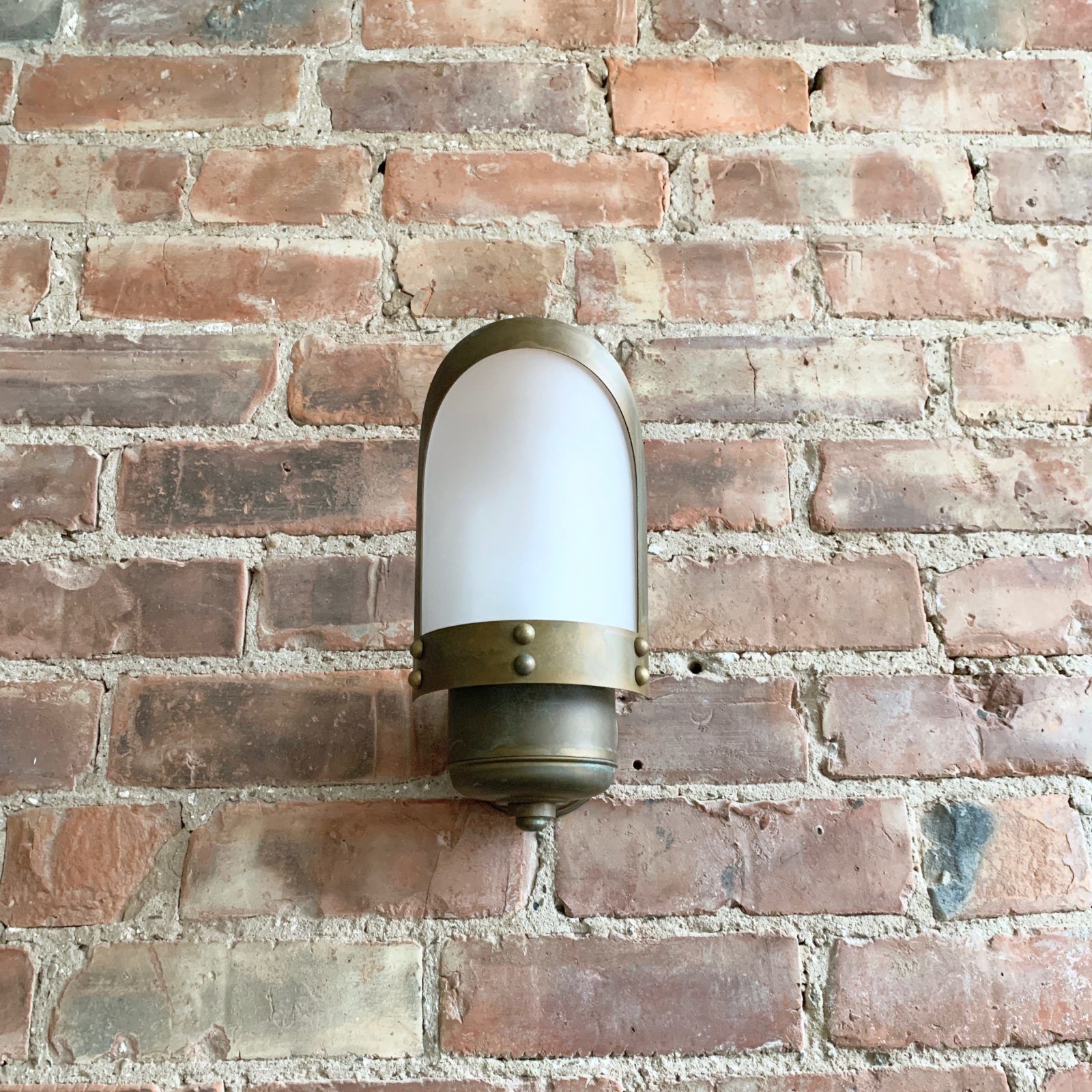 Contemporary Aged Brass Wall Light With Frosted Shade photo furniture
