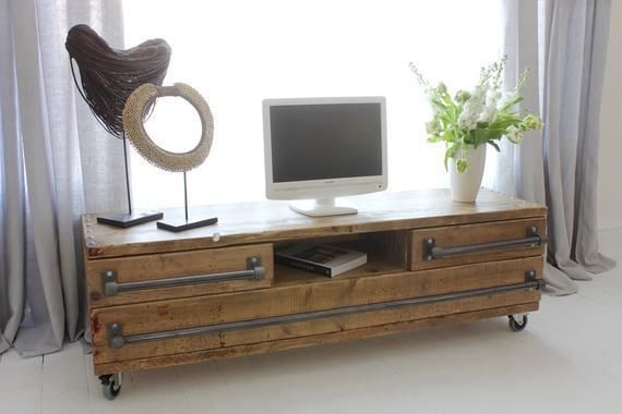 Stockton Bespoke Reclaimed Scaffolding Board Long Low Media Unit With Drawers, With Dark Steel Pipe Handles, And An Open Aperture On Castors
