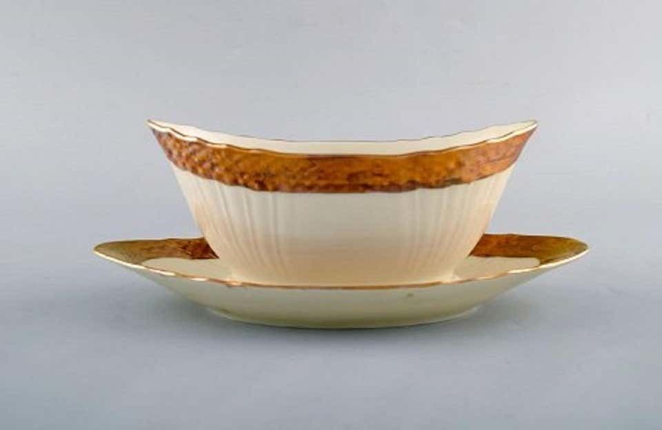 Royal Copenhagen Porcelain Sauce Boat With Floral Motifs And Gold Border photo furniture