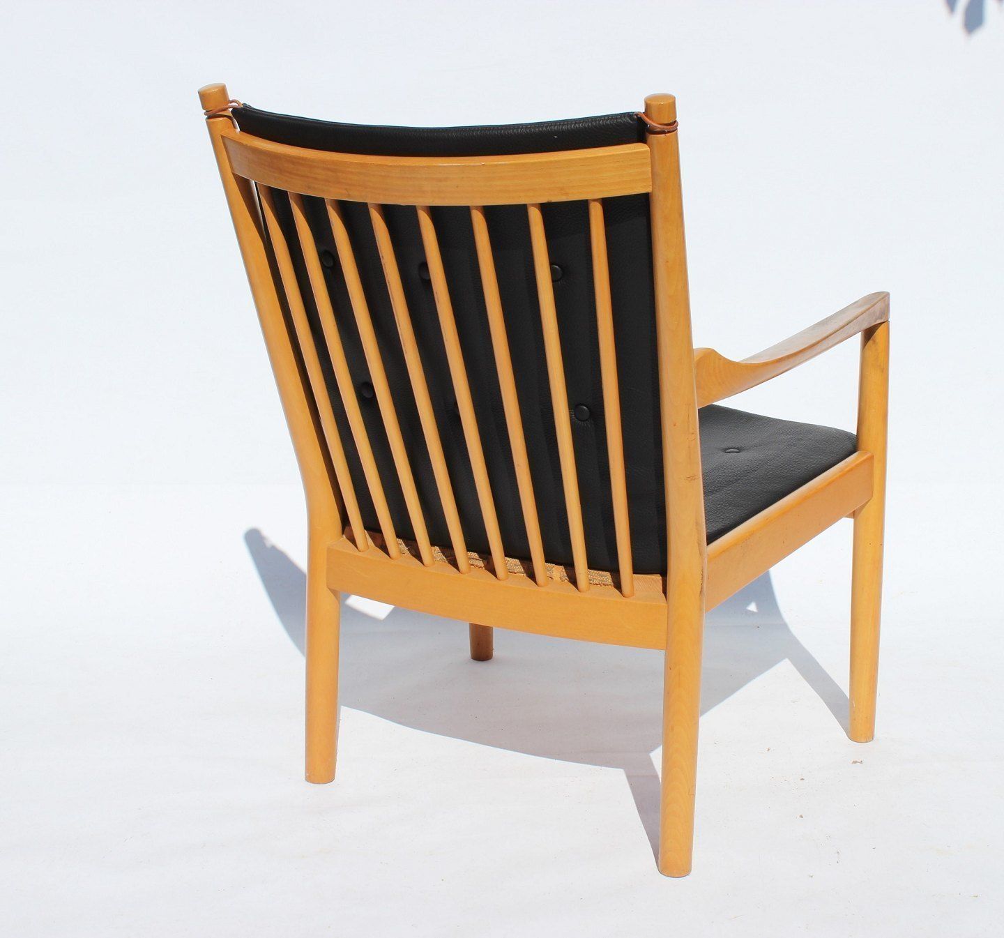 Armchair   Model 1788, With Beech Backrest And Cushions In Black Leather By Hans J. Wegner    Fritz Hansen, 1978. photo for sale