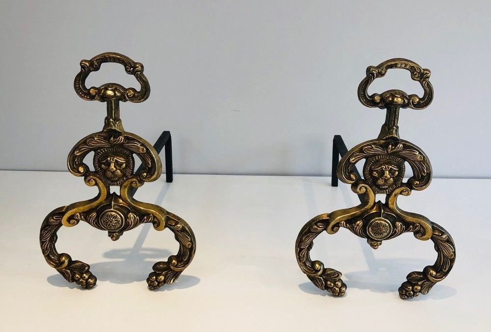 Pair Of Neoclassical Style Bronze And Wrought Iron Andirons With Lions Faces. French. Circa 1940