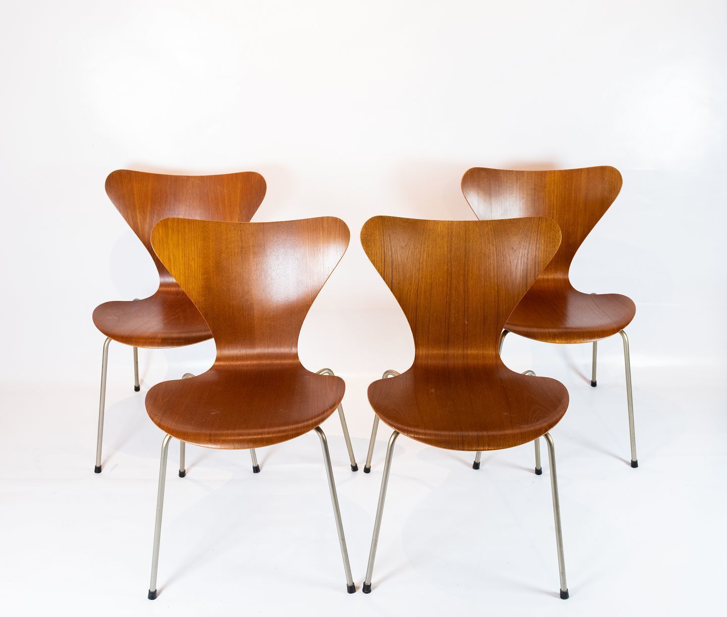 Set Of Four Seven Chairs, Model 3107, In Teak Designed By Arne Jacobsen And Manufactured By Fritz Hansen.