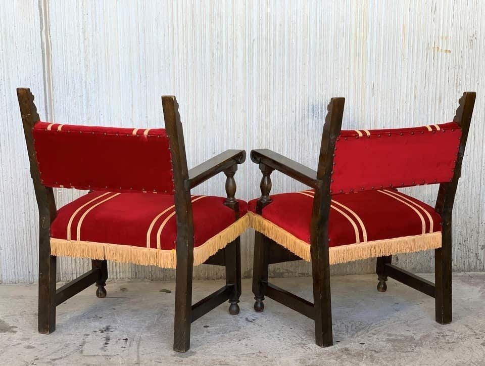 photo furniture Ensemble de six fauteuils bas espagnols d'époque XIXe siècle en noyer sculpté, revêtement en velours rouge à franges jaunes