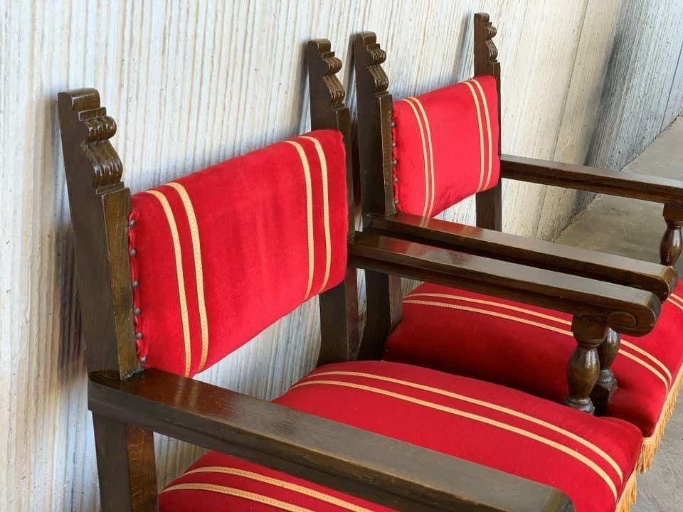 photo for sale Ensemble de six fauteuils bas espagnols d'époque XIXe siècle en noyer sculpté, revêtement en velours rouge à franges jaunes