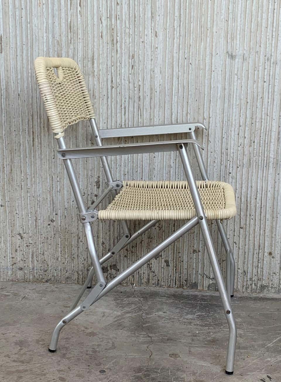 Paire de fauteuils pliants mid-century modern en rotin laqué et aluminium photo buy